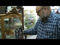 John Ferguson, co-owner of Ferguson Antiques rare beer stein