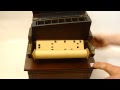 A late 19th century walnut cased roller organ
