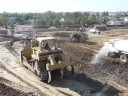 Long clip of CAT dozer & scraper action Long clip of CAT dozer & scraper action
