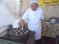 Lady making Kanom Krok at Wat Thai Temple in North Hollywood