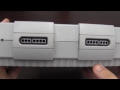 Classic Game Room presents a CGRundertow video game console review of the Super Nintendo (SNS-001). The SNES wasn't the first 16-bit system on the block, but it would go on to be the top selling console of the era with almost 50 million units sold worldwide. Released in North America in August of 1991, the beloved Super Nintendo featured impressive technology and a fantastic game library to account for its massive success in the console wars against competitors like the Sega Genesis or TurboGrafx-16. This review showcases the SNES console and its features with commentary from CGRundertow reviewer Kevin. Check out more reviews from Classic Game Room at www.YouTube.com www.YouTube.com and www.YouTube.com For the latest trailers visit www.YouTube.com Get more Classic Game Room on Facebook at www.facebook.com and at www.ClassicGameRoom.com.