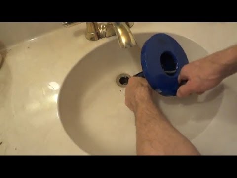 how to use a drain auger