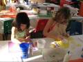 Ella and Morgan painting sand dollars at Westgate Lakes