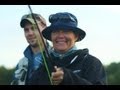 fly fishing girl Mette playing a rainbow trout