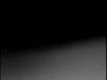 UV Induced Motion of a Silica-Fluorescent Dusty Plamsa