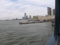 me and my friend are on the staten island ferry as it pulls out of manhattan. yay! you can here the ferry's horn!! we got yelled at for sticking our heads out the window...lol