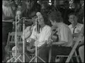 joan baez & bob dylan - with god on our side 1963 live

oh my name it is nothin'
my age it means less
the country i come from
is called the midwest
i's taught and brought up there
the laws to abide
and that land that i live in
has god on its side.

oh the history books tell it
they tell it so well
the cavalries charged
the indians fell
the cavalries charged
the indians died
oh the country was young
with god on its side.

oh the spanish-american
war had its day
and the civil war too
was soon laid away
and the names of the heroes
i's made to memorize
with guns in their hands
and god on their side.

oh the first world war, boys
it came and it went
the reason for fighting
i never did get
but i learned to accept it
accept it with pride
for you don't count the dead
when god's on your side.

in a many dark hour
i've been thinkin' about this
that jesus christ
was betrayed by a kiss
but i can't think for you
you'll have to decide
whether judas iscariot
had god on his side.

so now as i'm leavin'
i'm weary as hell
the confusion i'm feelin'
ain't no tongue can tell
the words fill my head
and fall to the floor
and if god's on our side
he'll stop the next war.