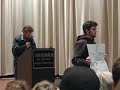 sean penn came to sfsu on dec. 7 to give a speech to (kind of) endorse dennis kucinich, and towards the end of the speech, leigh wolf, president of the college republicans at sfsu stood up and held a few signs. a kucinich supporter confronted him. sean penn continued with his speech.