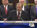 Legislators and business groups explain a plan that would build a new stadium for the Minnesota Vikings football team by taxing items sports fans use.