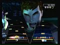 me and my mom playing rock band. im on guitar shes ob bass. me left her right.