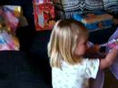 Emilia Opens A Present