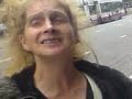 BIG ISSUE WOMAN OOTSIDE AE STATION