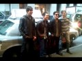 Big Time Rush photos with their taxi.