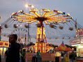 The Yo-Yo in the evening with the lights one. You can see the Freak Out behind it, as well as a Ferris wheel-type ride.
