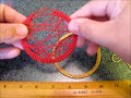 Click here to watch this video criss cross web earring hoops