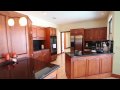 Presented by Jeff Lichtenstein.....Surrounded by water & beautiful landscaping, this 3BR + study is situated on 1/3rd acre. A long driveway gives a warm approach and offers plentiful parking. A true foyer greets you to a formal living room and dining room overlooking the pool and lake. The kitchen has been remodeled and is open with volume ceilings and a pass-thru to the loggia. Lots of granite, oak cabinetry, and stainless steel appliances, including wall oven, pantry pullouts, and wine cooler, all a chef's delight. An inviting family room is off the kitchen, complete with a cozy stone fireplace. The master is spacious with huge master bath suite and California closets. 2 split guest bedrooms and separate split den make for a perfect floorplan. Future expenses & peace of mind have been taken care of with newer roof, AC compressors, fabric hurricane protection, A/C garage, and interior remodeling. Low HOA fees and non-mandatory membership keep your cost of living to a minimum. Best of all is the outdoor living with newly resurfaced deck & pool. Lake views from multiple directions, large direct yard, and separate fenced yard make for sensational social gatherings