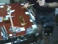 Opening a can of honey in microgravity