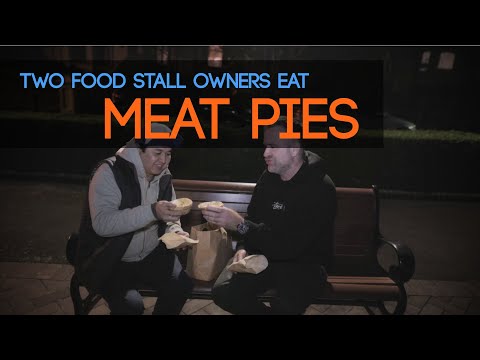 Two Sydney Food Stall owners eat Meat Pies