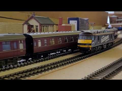 DB Blue (90034) on railtours passes Backbone (90039) on route training at Rose Heath