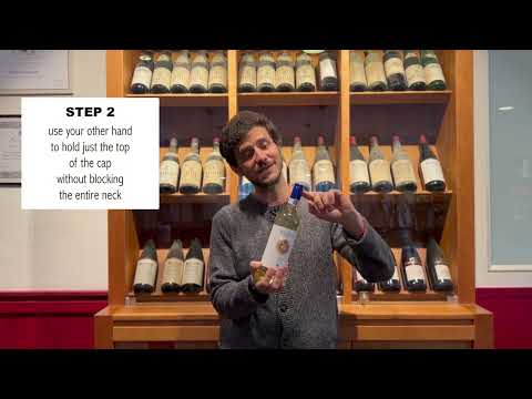 Part of a video titled TUTORIAL - How to open a Screw cap wine bottle - YouTube