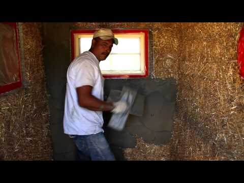 Applying interior scratch coat over straw baile house