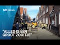 Ondergelopen straten en beschadigde huizen door gesprongen waterleiding