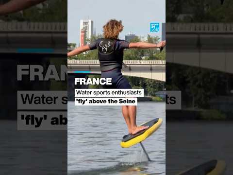 France: Water sports enthusiasts 'fly' above the River Seine