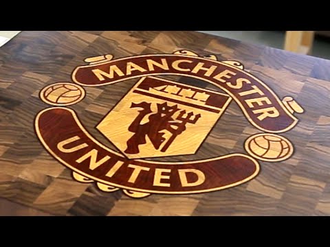 Customer milling with High-Z Manchester United Man Utd logo in wooden board cutting board