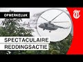 Helikopter redt man uit woeste rivier