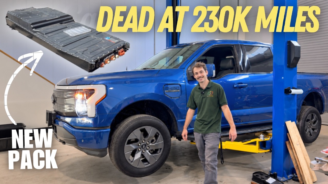 Ford F-150 Lightning on a lift with its battery pack lowered onto a table