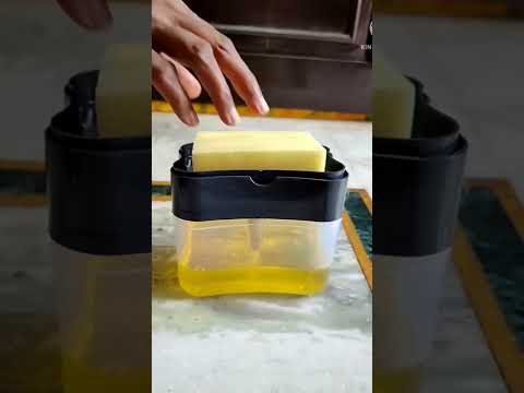 Imported plastic 2-in-1 liquid soap dispenser on countertop ...