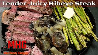 Tender Juicy Ribeye Steak with Sautéed Onions, Mushrooms and Asparagus