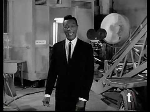 Nat King Cole sings "Day In Day Out"