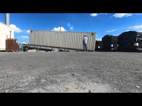 Part of a video titled How To Deliver A 40ft Sea Container - YouTube