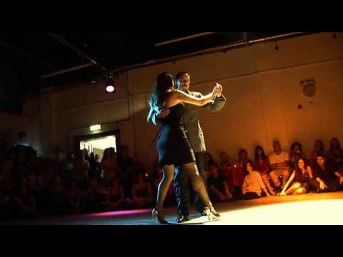  David Alejandro Palo  and  Milena Plebs  are  dancing  to  a  tango