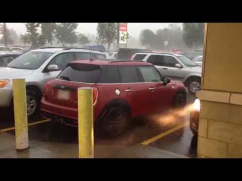 Looking at Mini Cooper S 5 door in heavy rain