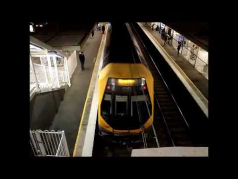 CityRail Millennium M Set Train arriving at Leumeah station at night