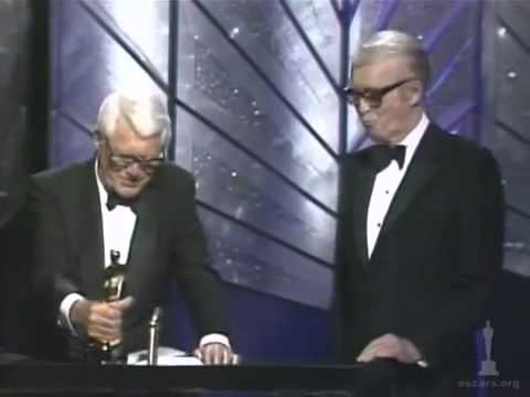 James Stewart receiving an Honorary Oscar from Cary Grant (1985)