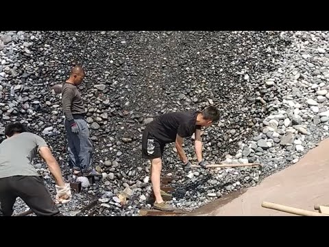 My daily work on the barge- Barge unloading cobblestone- the flow of cobblestone helps you relax
