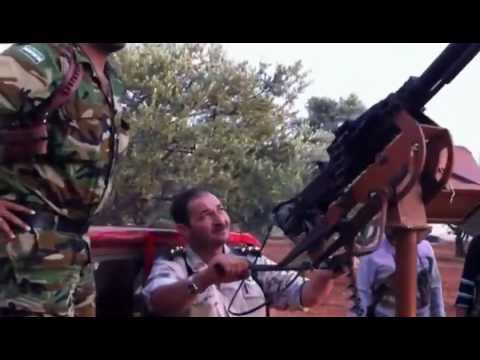 النقيب عمار الواوي يتدصي للطيران المروحي في محيط وادي الضيف في ريف ادلب بواسطة رشاش 14