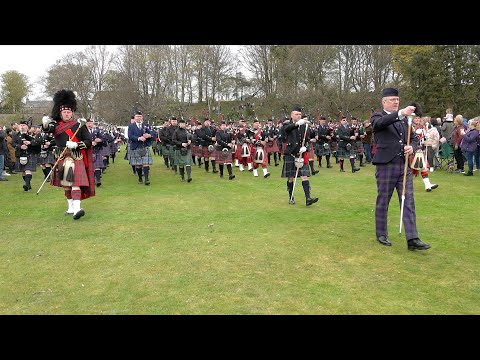 Massed pipe bands of Scottish Highlands playing I See Mull on the march in Crawl Park Alness 2023