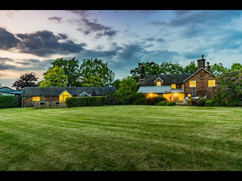 Sandstone farmhouse with glorious castle views and extensive outbuildings of over 8,000 square feet