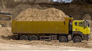 Trucks loaded and leaving the quarry pit. SHALE MINING S6•E11