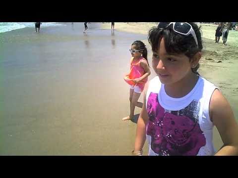 Nikki and Kiana at the beach with dad