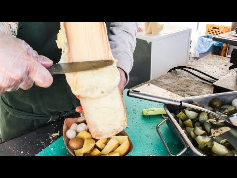 Swiss Raclette. Huge Melted Cheese Tasted in Prague. Street food of the Czech Republic