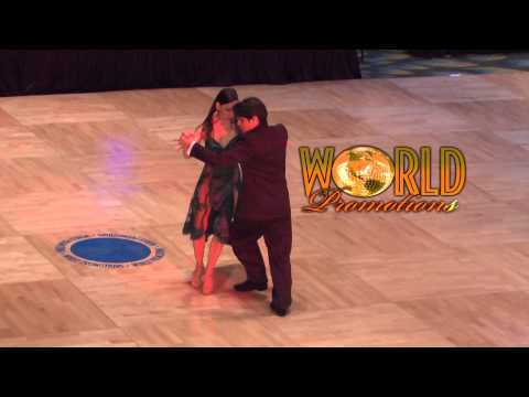  Adrian Veredice  and  Alejandra Hobert  are  dancing  to  the  tango  "  Recuerdo  "  by  Osvaldo Pugliese  in  2014