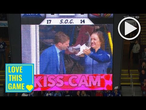 Mark Masters smooches a fish on "Kiss Cam" during Sens-Leafs preseason game