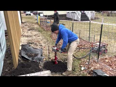 Using the Little Beaver to auger holes for fence posts.