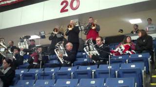 Salvation Army band plays carols during Michigan Warriors game
