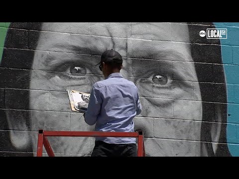 Danny Trejo gets a touch-up on Mural Mile